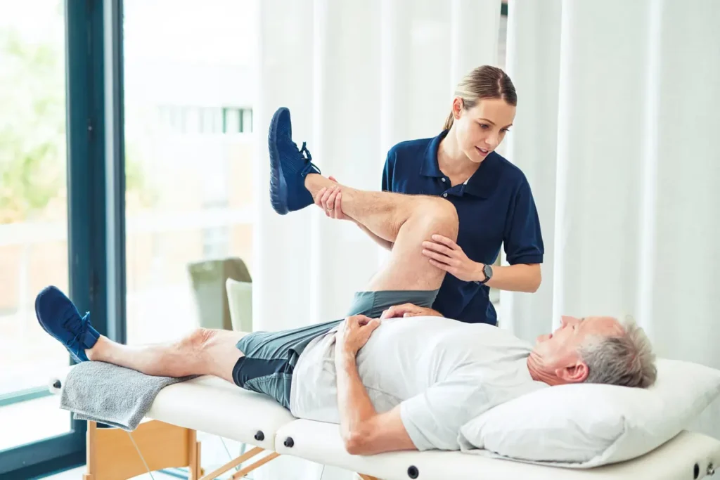 Revitalising Recovery: Effective Rehabilitation Strategies for Muscle Injuries 3 Physiotherapist assisting a patient with muscle recovery exercises Watford