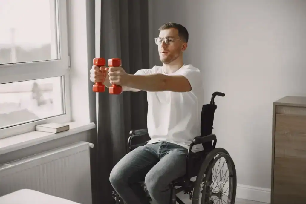 Image of man doing exercise in his wheelchair to aid weight loss Watford