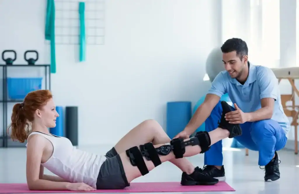 Woman having treatment to help muscle recovery Watford after an injury