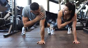 Sculpting Sleek Arms: The Essential Role of Cardio in Toning Without Bulking Up 1 Image of man and woman doing Cardio Watford to tone their arms.